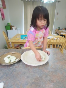 Elspeth was unhappy that she wasn't allowed to chop.  Eventually she got into laying the apples and adding cinnamon.