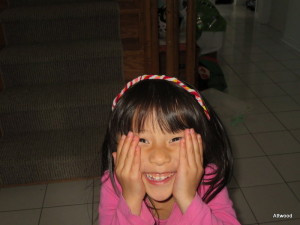 Oh, and some random cuteness.  She made this headband out of pipe cleaners.