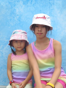 Two hot girls waiting for their popsicles to arrive.