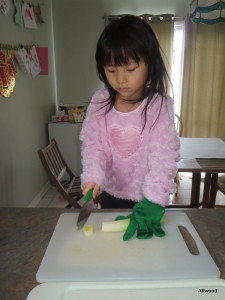 Helping to make leek and potatoe soup.