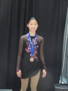 A bronze medal in her new dress.