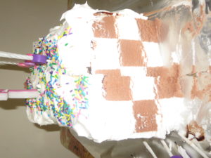 Easiest ice cream cake ever.  Bar of ice cream covered in whip cream and sprinkles and voila!
